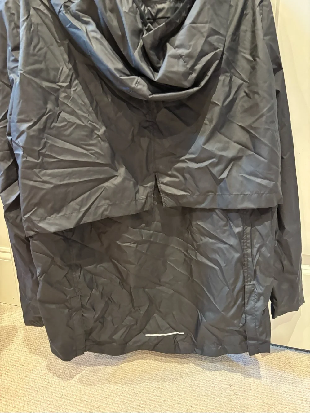 Nike Black Hooded Rain Jacket with Reflective Swoosh. Longer in back, hood.